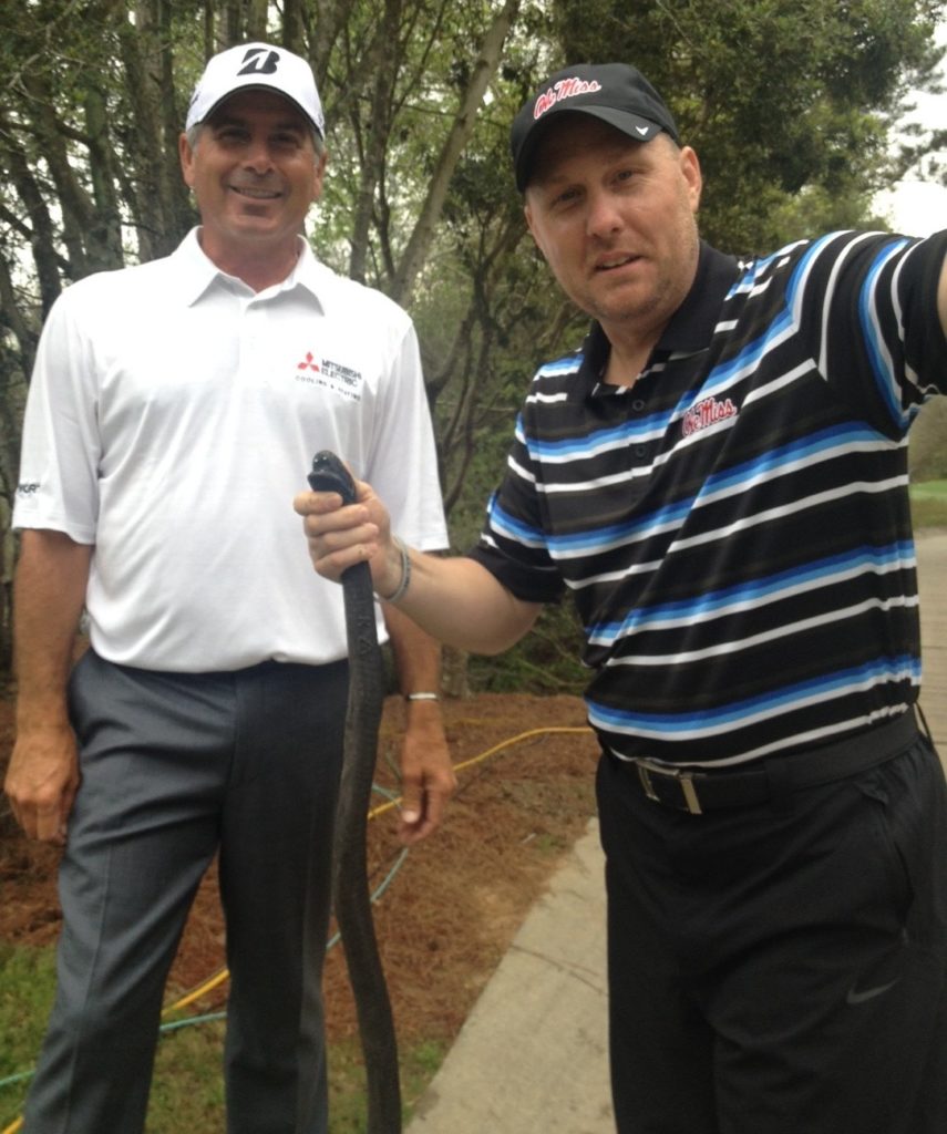 Fred Couples, Hugh Freeze and the critter with no shoulders.